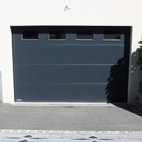 porte de garage sectionnelle en sous-sol grise anthracite